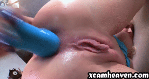Hard anal masturbation with a blue dildo