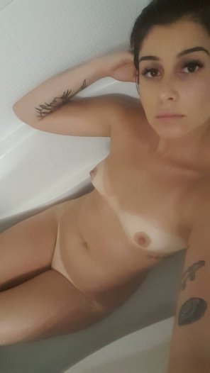 Cute brunette in the tub