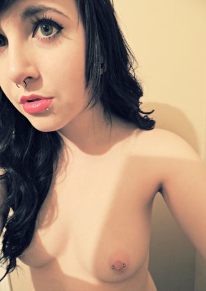 Green eye and nipple ring.