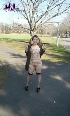 amateur photo Japanese slut with body writing in the park.