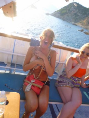 Happy and embarrassed on a boat