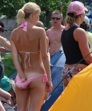 Adjust her bikini bottom