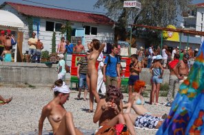 Completely naked on public beach