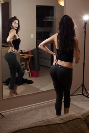 Checking herself out in the mirror