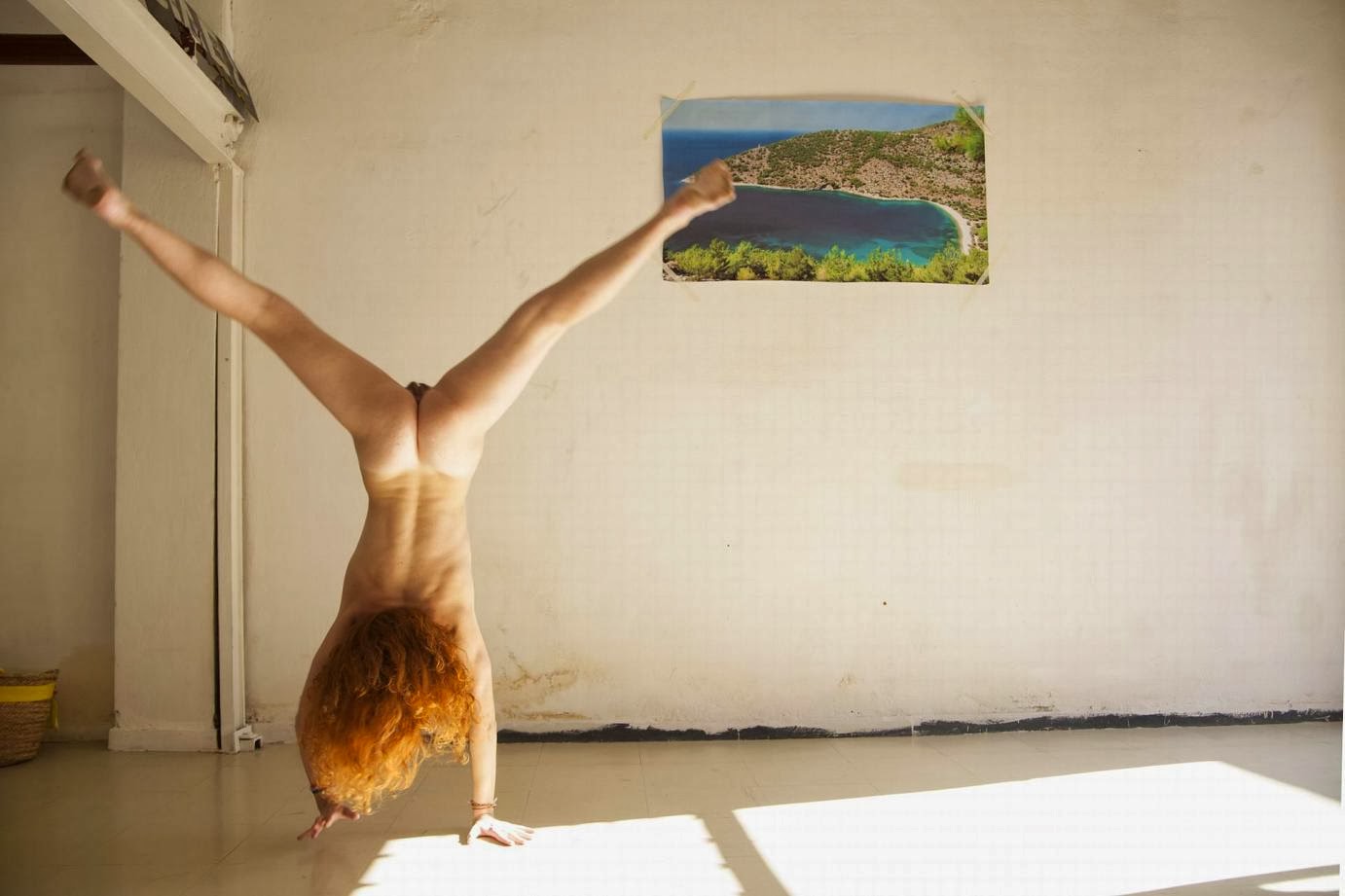 Naked Big Breasted Woman Doing Handstand.