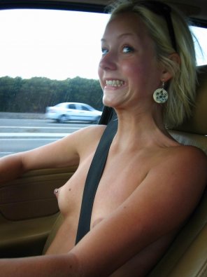 Topless in her car