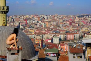 amateur pic High atop Istanbul, Turkey, Batwoman scans the cityscape for the thief who stole her clothes