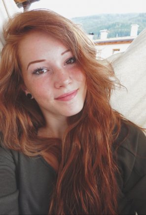 Gorgeous redhead with brown eyes