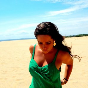 Busty, on the beach, in a dress. Does it get any better than that?