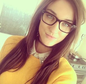 yellow sweater and glasses
