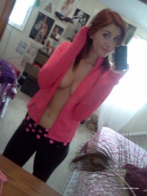 A pink jacket and yoga pants