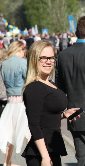 Bespectacled busty blonde
