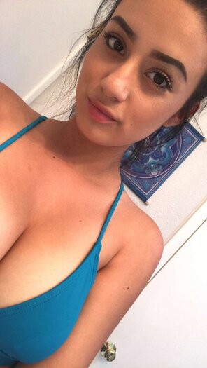 amateur photo Slutty Girl Shows off her busty chest