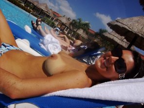 Topless hottie sunbathing