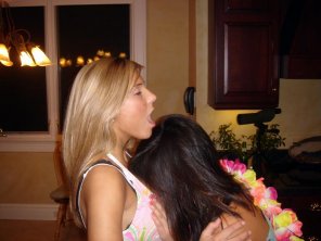 amateur pic Burying her face in the blonde's cleavage