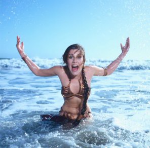amateur photo Slavegirl Leia jumping out of the ocean, with just a bit of underboob