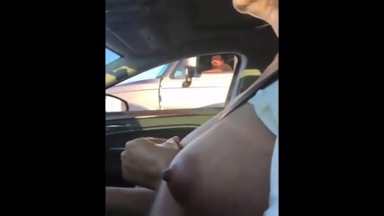 Mature Woman Touches Her Big Boob Rolling Next To A Trucks